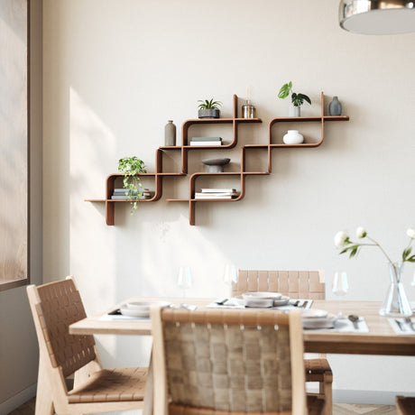 Wavy walnut wall shelves with plants and books above a dining table